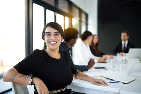 What started as a small opportunity is my biggest success. Portrait of a businesswoman sitting in a...