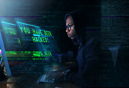 Cyber warfare. Cropped shot of a young man hacking into a secure computer network.の写真素材