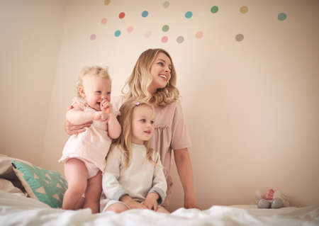 Family, a love that lasts forever. Shot of an adorable family of three bonding together at home.の写真素材