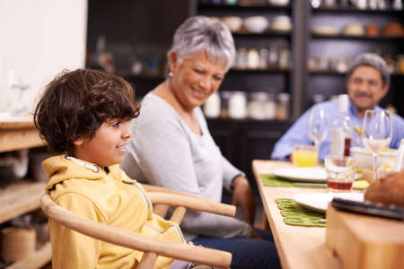 Dinner at grandpa and grandmas. A happy family eating dinner at home.