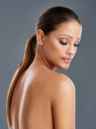 Every inch of her is perfect. Cropped shot of a beautiful young woman posing in the studio.の写真素材