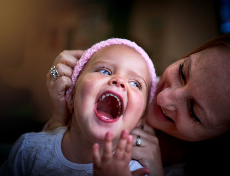 Kids bring great love into our lives. Shot of a mother bonding with her adorable little girl at home.の写真素材