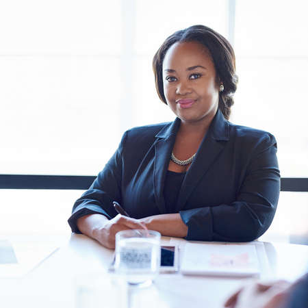 Be the game changer. Shot of a businesswoman sitting in an office.の写真素材