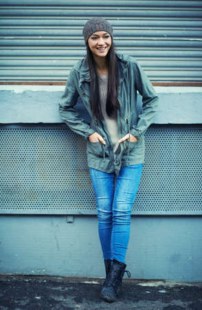 Shes an urban woman. Shot of an attractive young woman out in the city.の写真素材