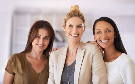 Theyre taking the fashion industry by storm. Shot of three beautiful businesswoman at work.の写真素材