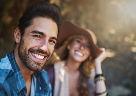 Getting outdoorsy with my love. Shot of a happy young couple spending time together in nature.