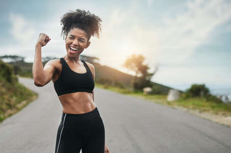 Strength comes from within. Cropped shot of an attractive young sportswoman flexing her bicep...