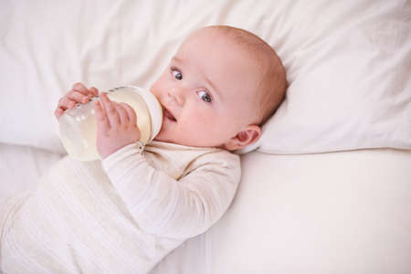 Learning and growing everyday. Shot of a cute and adorable baby boy at home.