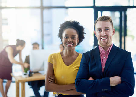 Working towards a successful business. Shot of corporate people working in a modern office.