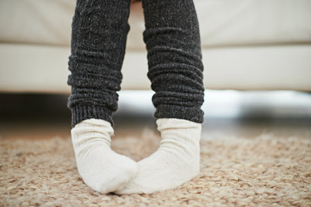 Life is better in socks. Cropped shot of a woman wearing socks and leg warmers.の写真素材