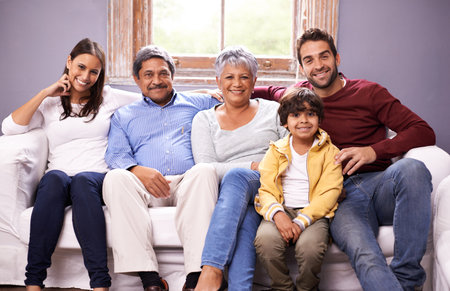 A special family moment. Portrait of a family bonding together in the living room.