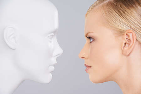 Face your problems. Close up of a woman looking at a dummy.