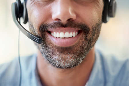 What can I do for you today. Cropped shot of a call centre agent working in an office.