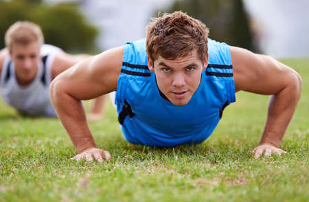 In the business of fitness. Closeup shot of a young man doing push-ups.