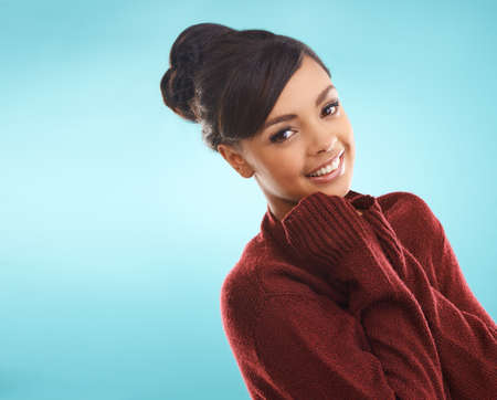 Shes staying warm this winter. Cropped portrait of a young woman posing in winter wear.