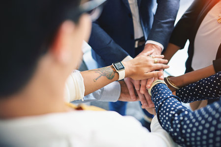 Go team. High angle shot of a group of coworkers hands in a huddle.