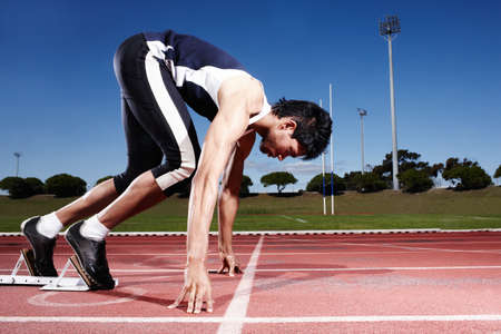 The process of preparation. A young runner getting ready for a race.
