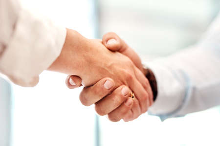 Work with those who want to succeed with you. Closeup shot of two unrecognisable businesspeople...