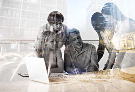 Theyve got plans for this city. Multiple exposure shot of a group of colleagues working in their office.の写真素材