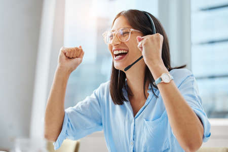 Another brilliant review from a client. Shot of an attractive young call centre agent sitting alone...