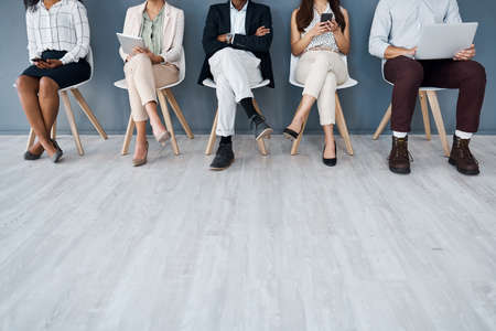 Whos going to be called up next. Closeup shot of a group of unrecognisable businesspeople using...