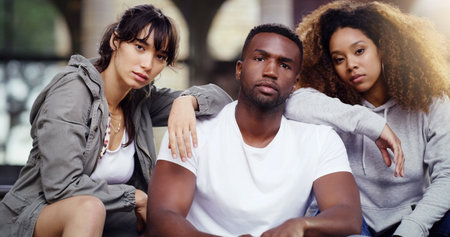 We set the mood in the city. Portrait of a group of friends posing together while relaxing outdoors.