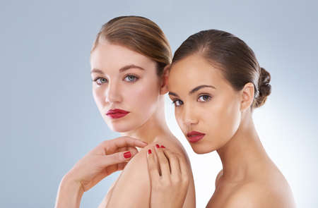 Beautiful...naturally. Studio beauty shot of a two young models.の写真素材