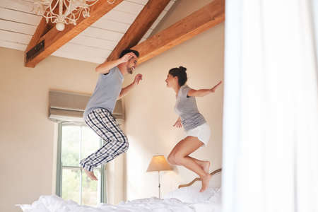 We bring a world of fun into each others lives. Full length shot of a cheerful young couple playing...