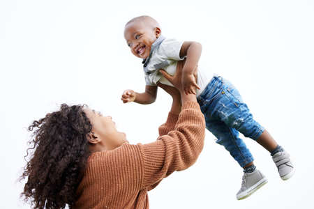 Nothing has brings me more peace. Shot of a mother playing with her son outside.の写真素材