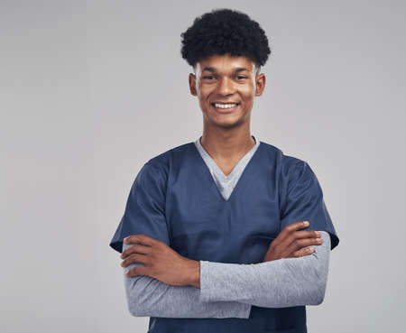 I love being able to contribute to peoples health. Shot of a medical practitioner standing against a...