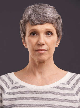 I dont know the way but Ill be there soon. Studio portrait of an elderly woman against a gray...