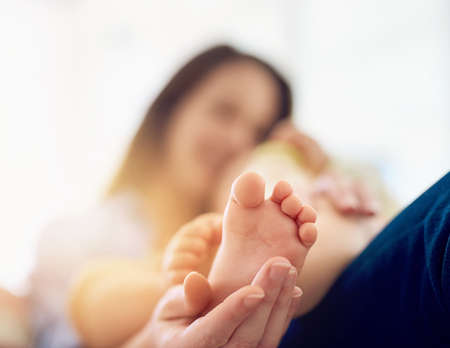 Enjoy the little things. Cropped shot of a mother touching her babys foot.の写真素材