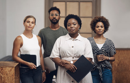 The toughest design team in the business. Portrait of a group of young businesspeople working...