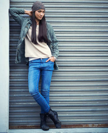 Shes an urban woman. Shot of an attractive young woman out in the town.の写真素材