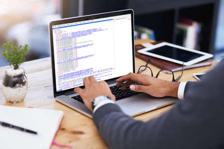 Using technology that drives productivity. Closeup shot of a businessman working on a laptop in an...