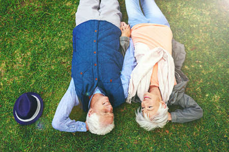 True love does exist. Shot of a senior couple enjoying the day together in a park.の写真素材