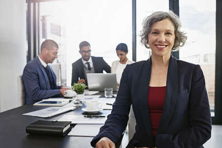 Ive got a great team behind me. Shot of businesspeople in an office.