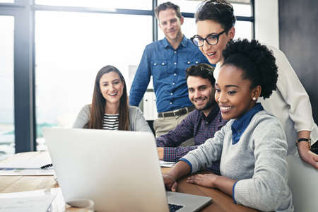 Getting some positive feedback. Cropped shot of a group of businesspeople meeting in the boardroom.