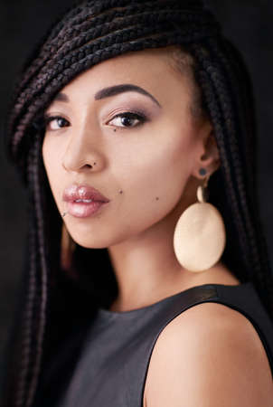 Beauty you cant look away from. Studio portrait of a beautiful young woman posing against a black background.の写真素材