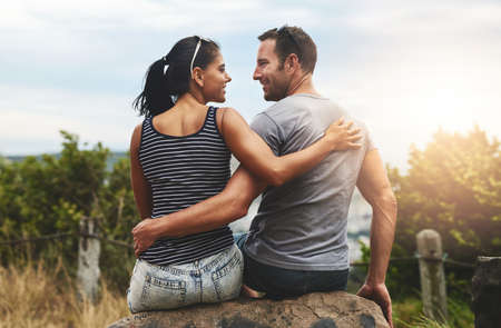 Every moment with you is a dream come true. Shot of a young couple enjoying a romantic day outdoors.の写真素材