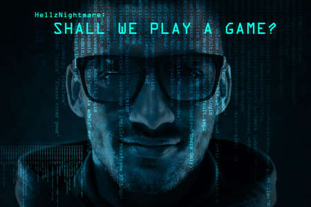 Playing a game of cat and mouse. Portrait of a menacing computer hacker posing against a dark...