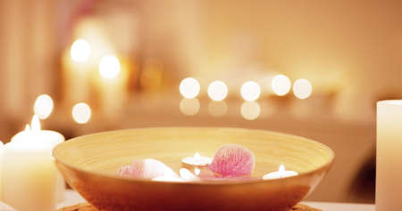 We help put your mind and body to ease. Still life shot of various spa essentials on a table.の写真素材