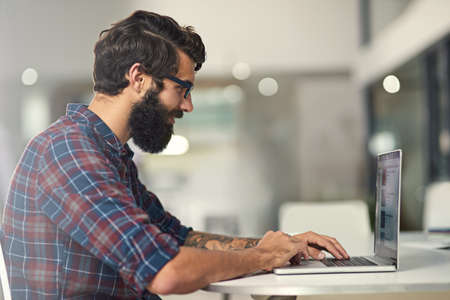 Following my passions while making a great living. Shot of a young designer working on his laptop.
