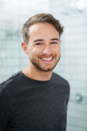 Ready to face to the day. Portrait of a happy young man standing in his bathroom.
