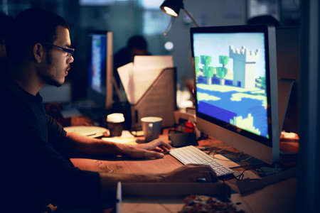 Doing digital battle. Shot of a popular video game.の写真素材