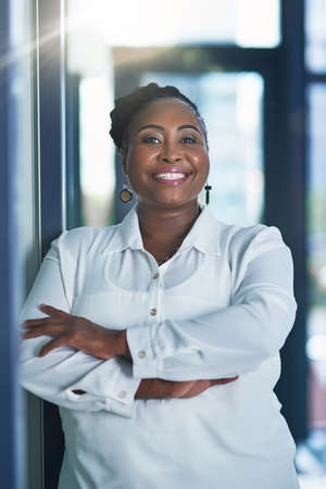 Just doing what I do best. Portrait of a happy businesswoman posing in the office with her arms...