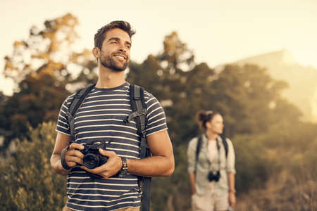 Nothing makes you feel as good as the outdoors. Shot of a man out hiking with his girlfriend...