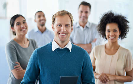 My team can achieve anything. Portrait of a group of diverse colleagues standing in an office.