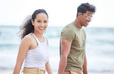 Enjoying our summer days. Shot of a young couple enjoying a day at the beach.