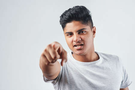 Change starts with you. Studio shot of a young man posing against a white background.